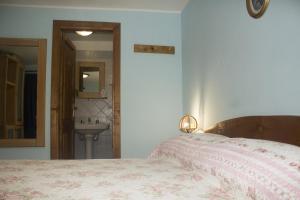 Postel nebo postele na pokoji v ubytování Anticarua B&B