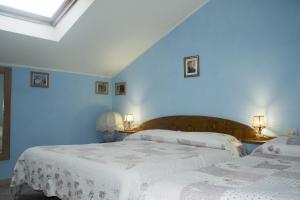 Postel nebo postele na pokoji v ubytování Anticarua B&B