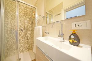 a bathroom with a sink and a shower at DolceVita Apartments N 439 in Venice