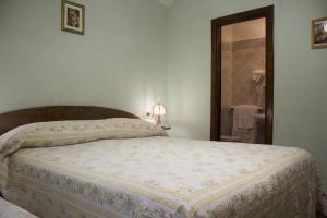 Postel nebo postele na pokoji v ubytování Anticarua B&B