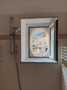 a window in a bathroom with a shower at House Camogli in Camogli +32 photos