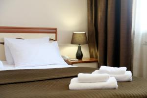 
Кровать или кровати в номере Мастер Отель Дубровка 
