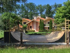 a house with a skateboard ramp in front of it at Somo Surfskate hostel in Castanedo
