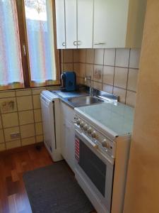Kuchyň nebo kuchyňský kout v ubytování Piccolo Paradiso + 20 fotografií
