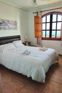 Ένα ή περισσότερα κρεβάτια σε δωμάτιο στο Shoal Apartamentos