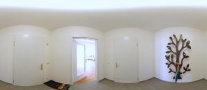 a room with white walls and a hallway with a doorway at Ferienwohnung Häckel in Kurort Oberwiesenthal