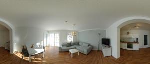 a living room with a couch and a table at Ferienwohnung Häckel in Kurort Oberwiesenthal