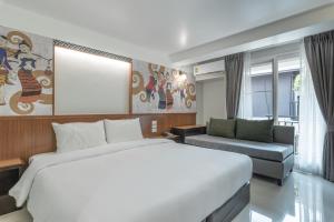 Postel nebo postele na pokoji v ubytování Cozytel Chiangmai