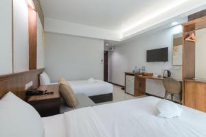 Postel nebo postele na pokoji v ubytování Cozytel Chiangmai