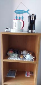 a book shelf with a cake on top of it at La camera del mulino in Levanto