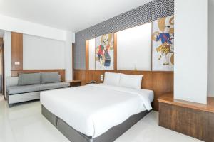 Postel nebo postele na pokoji v ubytování Cozytel Chiangmai