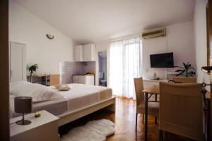 Postel nebo postele na pokoji v ubytování Apartments Korda L&M- Suhi Potok