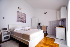 Postel nebo postele na pokoji v ubytování Apartments Korda L&M- Suhi Potok