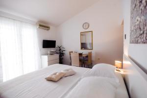 Postel nebo postele na pokoji v ubytování Apartments Korda L&M- Suhi Potok