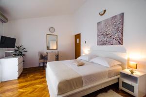 Postel nebo postele na pokoji v ubytování Apartments Korda L&M- Suhi Potok