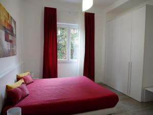Posteľ alebo postele v izbe v ubytovaní Denza Apartments