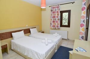 Postel nebo postele na pokoji v ubytování Moonbeam Hotel