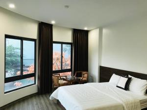 Postel nebo postele na pokoji v ubytování X9 Hotel