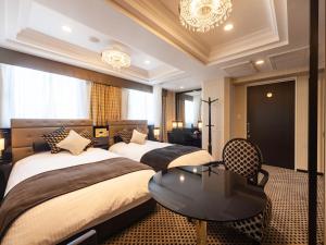 Postel nebo postele na pokoji v ubytování APA Hotel PRIDE Akasaka Kokkaigijidomae