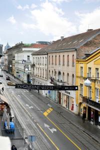 a city street with buildings and a street sign at M4You in Zagreb