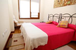 A bed or beds in a room at Jardín del Sella