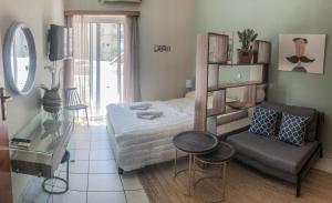 A bed or beds in a room at Sofia City Beach 3 Apts Nea Chora Chania steps from the beach