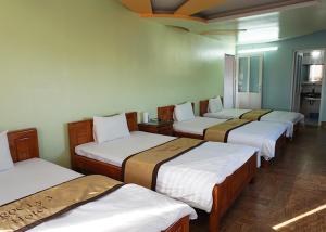 Postel nebo postele na pokoji v ubytování Khách Sạn Ngọc Ly 3