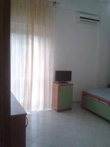TV a/nebo společenská místnost v ubytování Hotel Eden