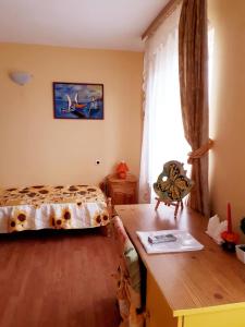 A bed or beds in a room at Hadjibulevata Guest House