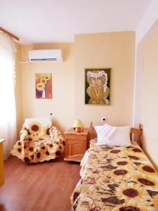 A bed or beds in a room at Hadjibulevata Guest House