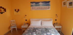 Posteľ alebo postele v izbe v ubytovaní Casa vacanze Osvaldo