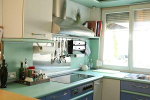 a kitchen with a sink and a stove top oven at Dimai House No 31 Dornbirn Messe in Dornbirn +26 photos