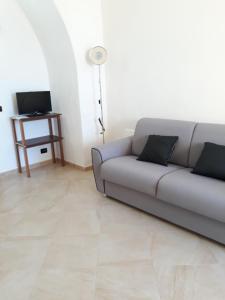 a living room with a couch and a table at Casa Vacanze Silvia in Pizzo