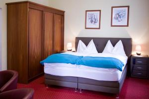 Letto o letti in una camera di Hotel Alter Telegraf