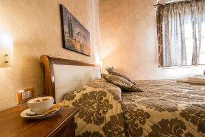 A bed or beds in a room at Antica Pieve B&B