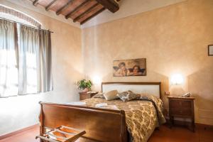 A bed or beds in a room at Antica Pieve B&B