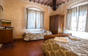 A bed or beds in a room at Antica Pieve B&B