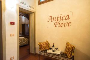 A bed or beds in a room at Antica Pieve B&B