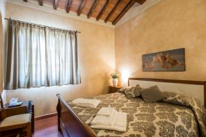 A bed or beds in a room at Antica Pieve B&B