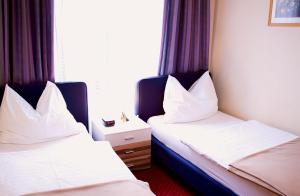Letto o letti in una camera di Hotel Alter Telegraf