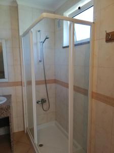a shower with a glass enclosure in a bathroom at Rossio Sol Mar in Lagos +41 photos