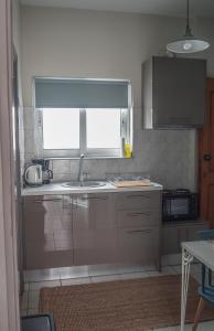 A kitchen or kitchenette at Sofia City Beach 3 Apts Nea Chora Chania steps from the beach Még 37 kép