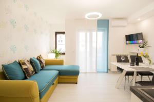 a living room with a couch and a table at Apartment Motovunska 39 in Poreč