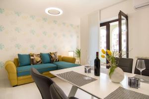a living room with a couch and a table at Apartment Motovunska 39 in Poreč