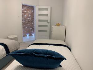 Posteľ alebo postele v izbe v ubytovaní Apartament Zacisze De LUX