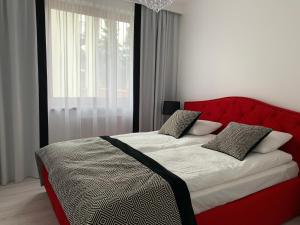 Posteľ alebo postele v izbe v ubytovaní Apartament Zacisze De LUX