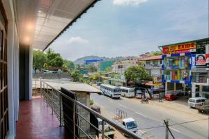 a balcony of a building with a view of a street at Kandy My Home stay in Kandy