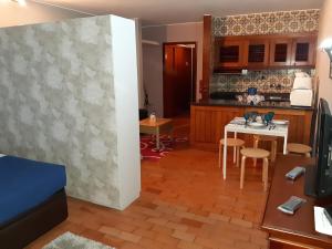 a kitchen and dining room with a table at Apartamentos Matur in Machico +37 photos