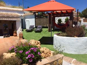 A garden outside Cueva Romana Cave House, Clothing Optional, Adult Only