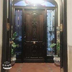 a black door in a room with plants at Casa Ronda 1808 ROOMS in Ronda